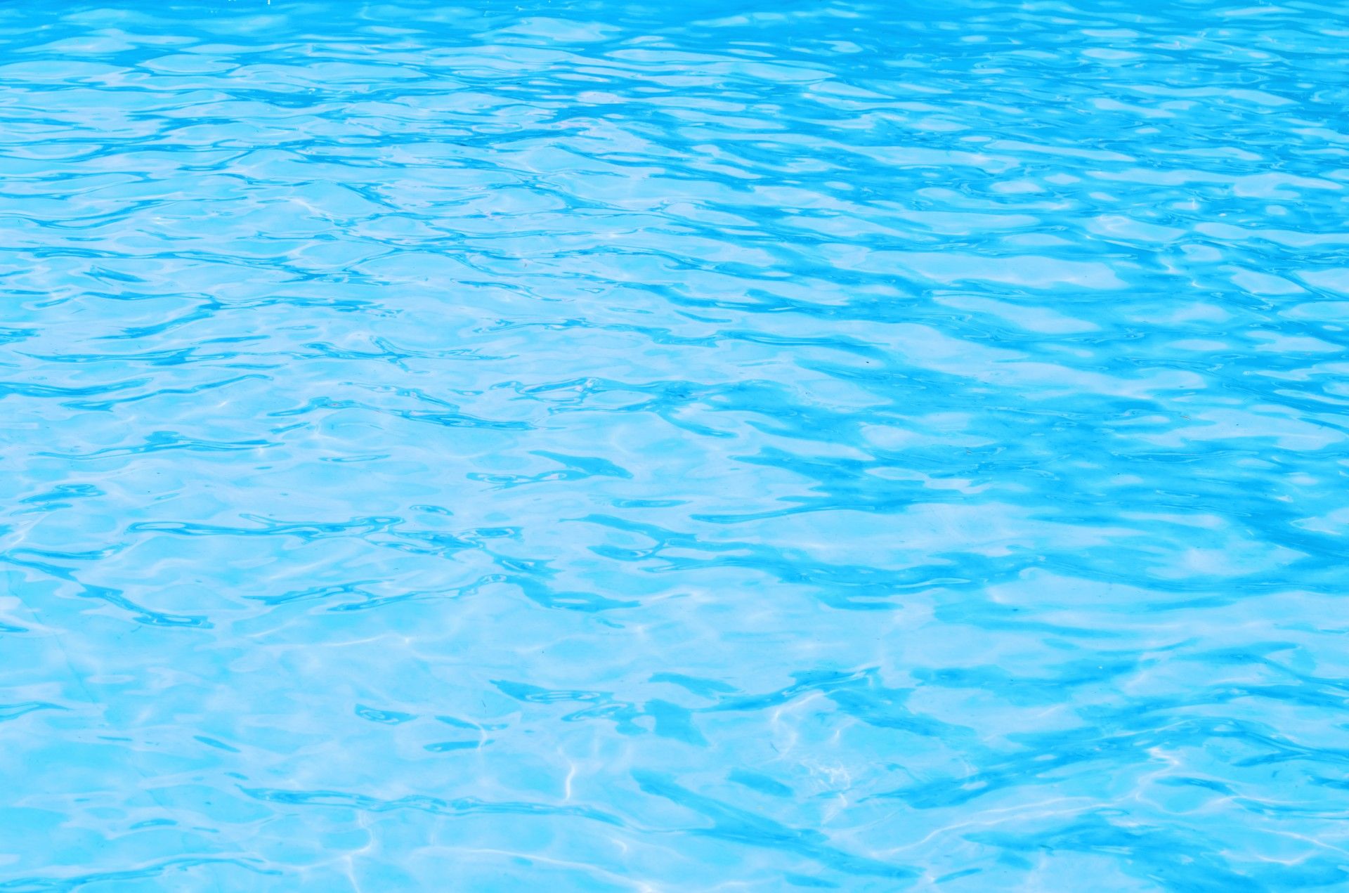 Sunlit, crystal-clear pool water